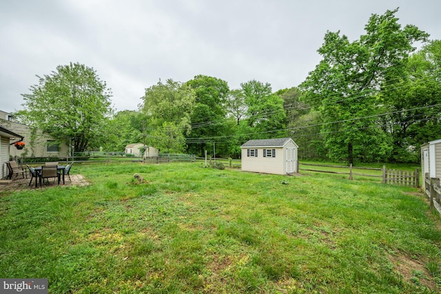 107 Juniper Dr, Levittown, PA 19056 - view of yard featuring a fenced backyard, an outdoor structure, and a storage shed