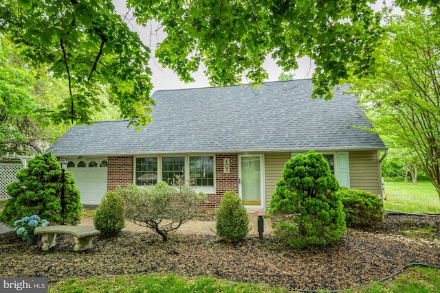 107 Juniper Dr, Levittown, PA 19056 - view of front of home with brick siding, roof with shingles, and a garage