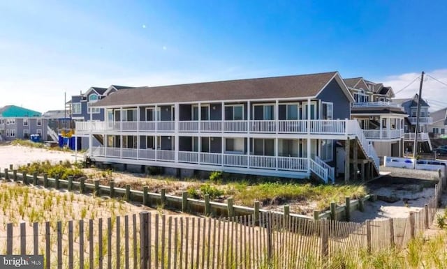 214 Leeward Ave, Beach Haven, NJ 08008 - view of building exterior featuring stairs and fence