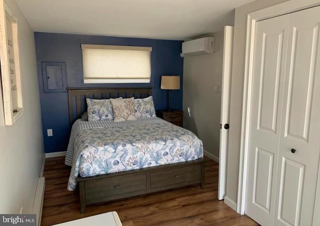 214 Leeward Ave, Beach Haven, NJ 08008 - bedroom featuring a closet, wood finished floors, a baseboard radiator, an AC wall unit, and baseboards