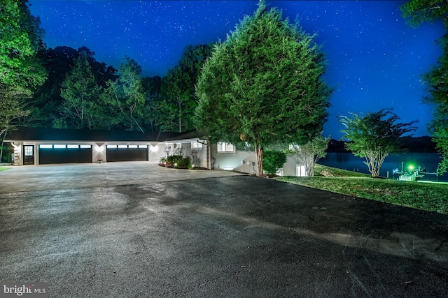 2031 Indian Cir, Saint Leonard, MD 20685 - view of front of home with concrete driveway and stucco siding