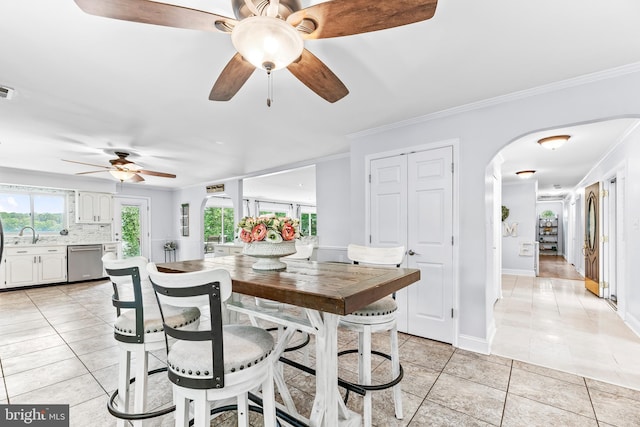 2031 Indian Cir, Saint Leonard, MD 20685 - dining room with a ceiling fan, baseboards, light tile patterned floors, crown molding, and arched walkways