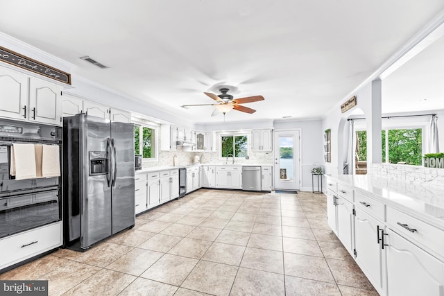 2031 Indian Cir, Saint Leonard, MD 20685 - kitchen with a sink, stainless steel appliances, a wealth of natural light, and decorative backsplash