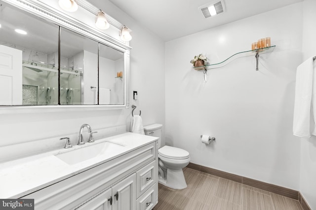 2031 Indian Cir, Saint Leonard, MD 20685 - full bathroom with toilet, a marble finish shower, visible vents, baseboards, and vanity