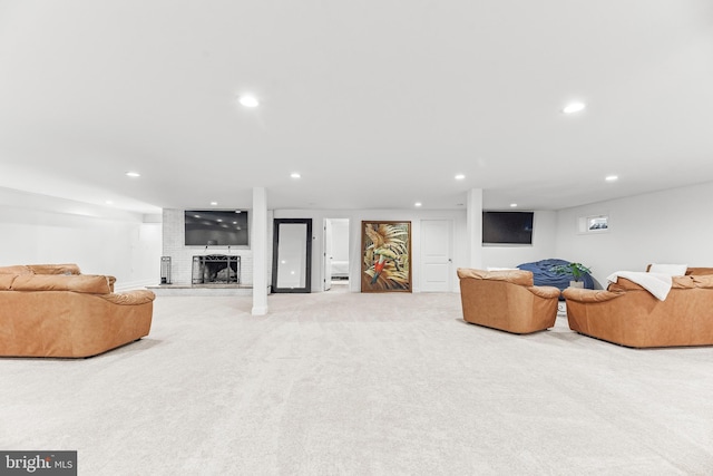 2031 Indian Cir, Saint Leonard, MD 20685 - living room with light carpet, recessed lighting, and a brick fireplace