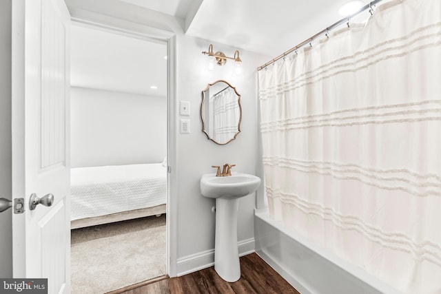 2031 Indian Cir, Saint Leonard, MD 20685 - bathroom with baseboards, shower / tub combo, and wood finished floors
