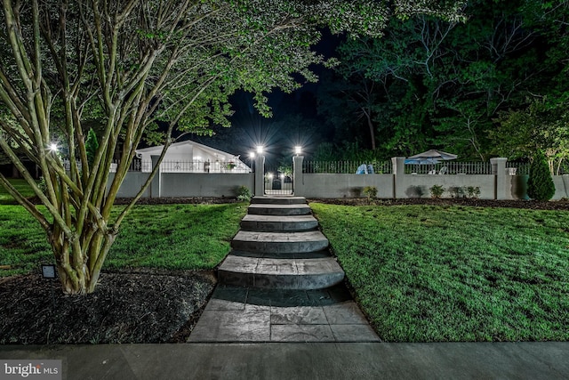 2031 Indian Cir, Saint Leonard, MD 20685 - yard at twilight with a fenced front yard and a gate