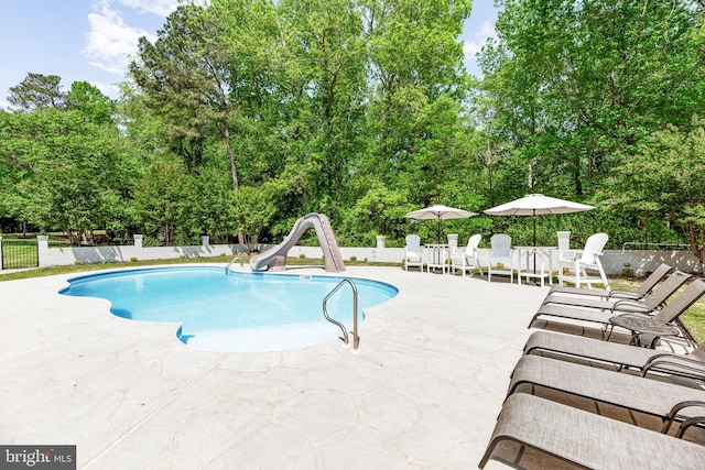 2031 Indian Cir, Saint Leonard, MD 20685 - view of pool with fence, a patio area, a fenced in pool, and a water slide