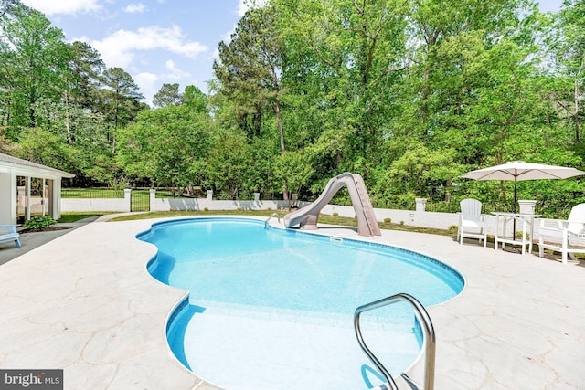 2031 Indian Cir, Saint Leonard, MD 20685 - view of swimming pool with fence, a patio area, a fenced in pool, and a water slide