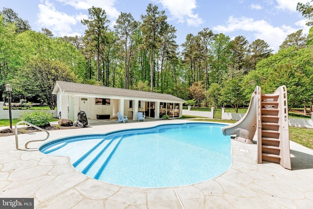 2031 Indian Cir, Saint Leonard, MD 20685 - pool featuring a patio, a water slide, an outbuilding, and an exterior structure