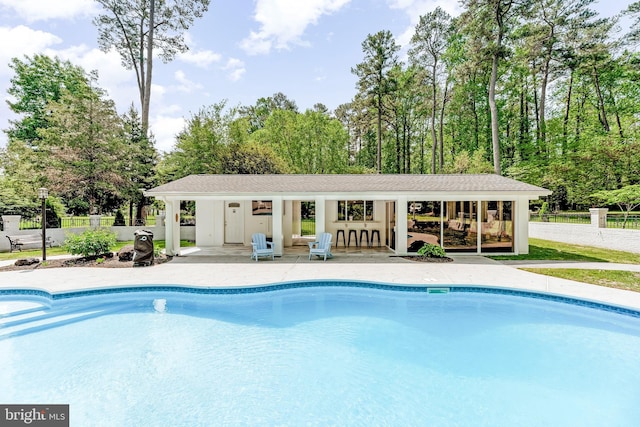 2031 Indian Cir, Saint Leonard, MD 20685 - outdoor pool with a storage structure, an outdoor structure, fence, and a patio