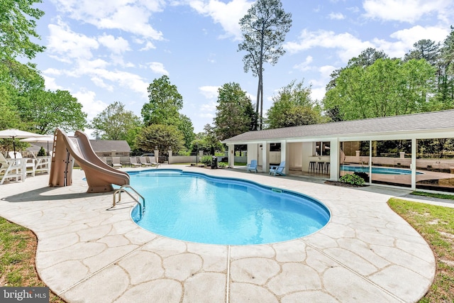 2031 Indian Cir, Saint Leonard, MD 20685 - view of pool featuring a patio area, a fenced in pool, a water slide, and fence