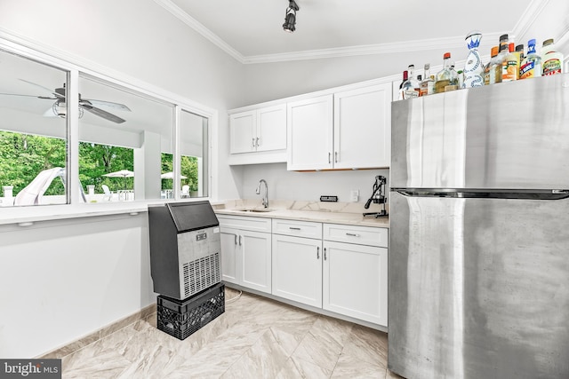 2031 Indian Cir, Saint Leonard, MD 20685 - kitchen with a sink, freestanding refrigerator, crown molding, white cabinetry, and a ceiling fan