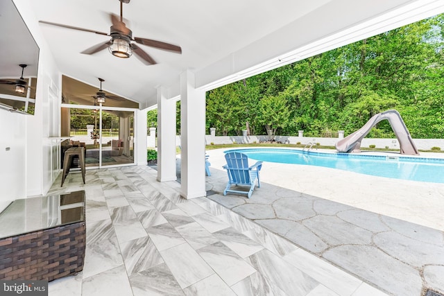 2031 Indian Cir, Saint Leonard, MD 20685 - view of swimming pool with fence, a patio, a water slide, a fenced in pool, and a ceiling fan