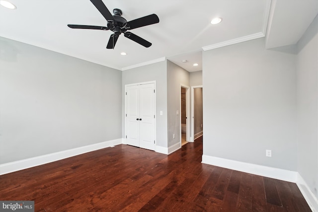 spare room with crown molding, wood-type flooring, baseboards, a ceiling fan, and recessed lighting