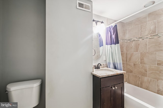 full bathroom featuring shower / tub combo, vanity, and toilet