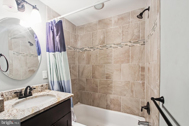 full bath featuring shower / bath combo with shower curtain and vanity