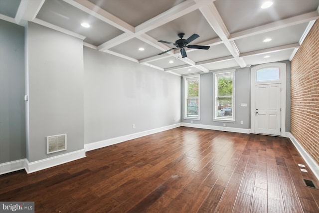 spare room featuring dark wood-type flooring, baseboards, ceiling fan, beamed ceiling, and coffered ceiling