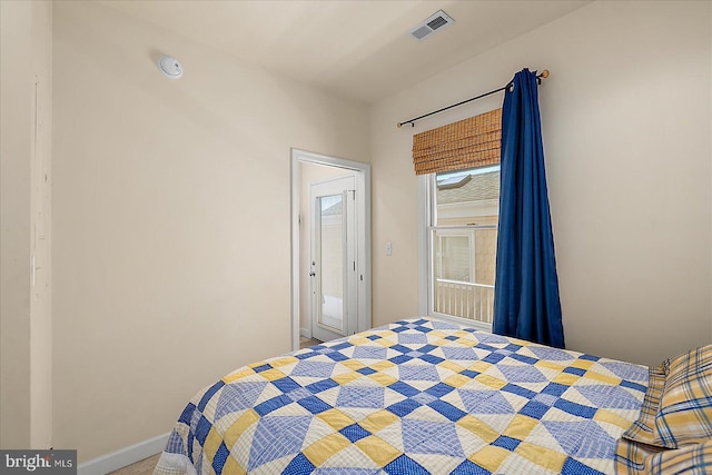 22 Flounder Ln, Ocean City, MD 21842 - carpeted bedroom featuring visible vents, baseboards, and access to exterior