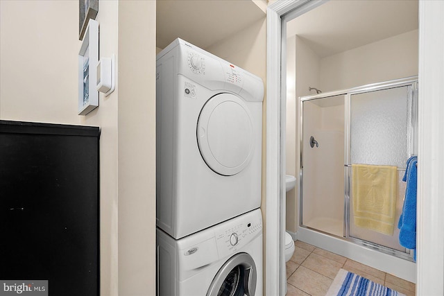 22 Flounder Ln, Ocean City, MD 21842 - laundry room with laundry area, stacked washer and clothes dryer, and light tile patterned floors