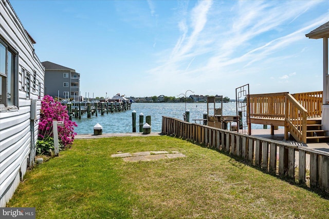 22 Flounder Ln, Ocean City, MD 21842 - dock area featuring a lawn and a water view