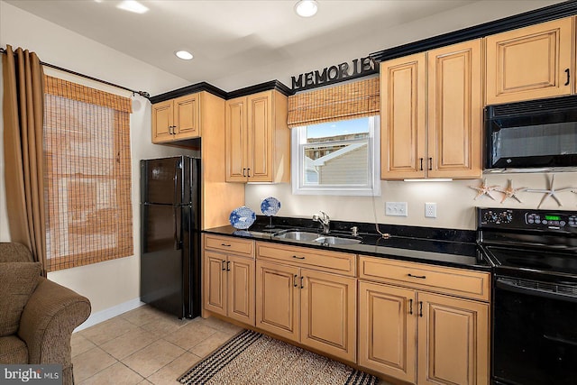 22 Flounder Ln, Ocean City, MD 21842 - kitchen with dark countertops, light tile patterned floors, black appliances, and a sink
