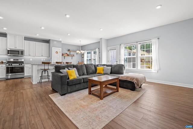 4286 Sunset Dr, Charlottesville, VA 22911 - living area with healthy amount of natural light, recessed lighting, hardwood / wood-style floors, a chandelier, and baseboards