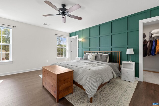 4286 Sunset Dr, Charlottesville, VA 22911 - bedroom with a decorative wall, wood finished floors, a spacious closet, a closet, and baseboards