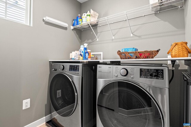 4286 Sunset Dr, Charlottesville, VA 22911 - laundry room with washing machine and clothes dryer and baseboards