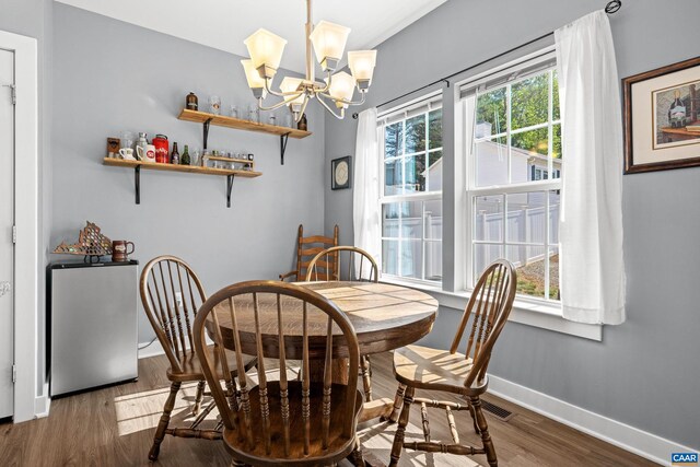 4286 Sunset Dr, Charlottesville, VA 22911 - dining room with a chandelier, baseboards, and wood finished floors