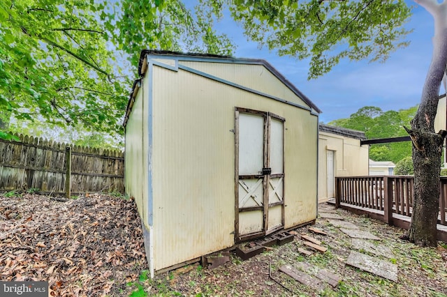 view of shed with fence