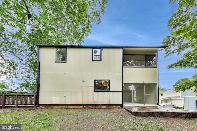 back of property with fence