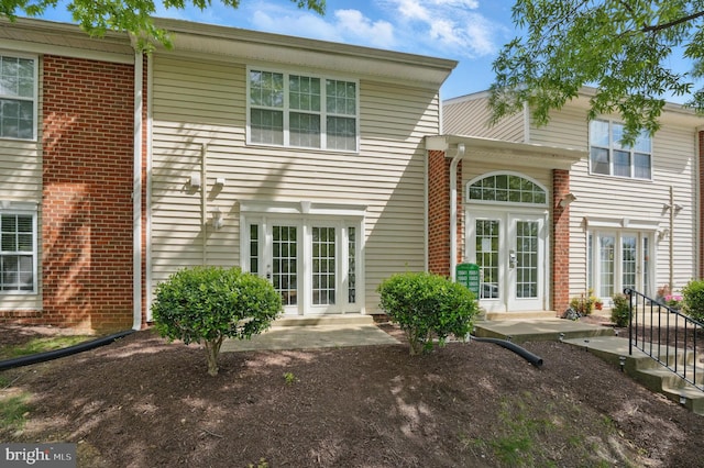 15645 Horseshoe Ln, Woodbridge, VA 22191 - rear view of house with brick siding and french doors
