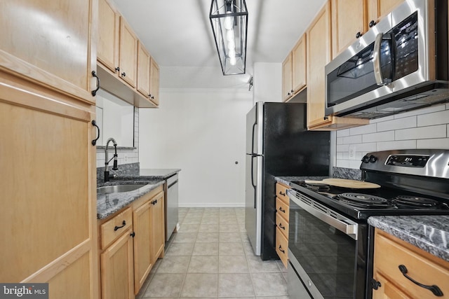 15645 Horseshoe Ln, Woodbridge, VA 22191 - kitchen with light brown cabinets, tasteful backsplash, appliances with stainless steel finishes, and a sink