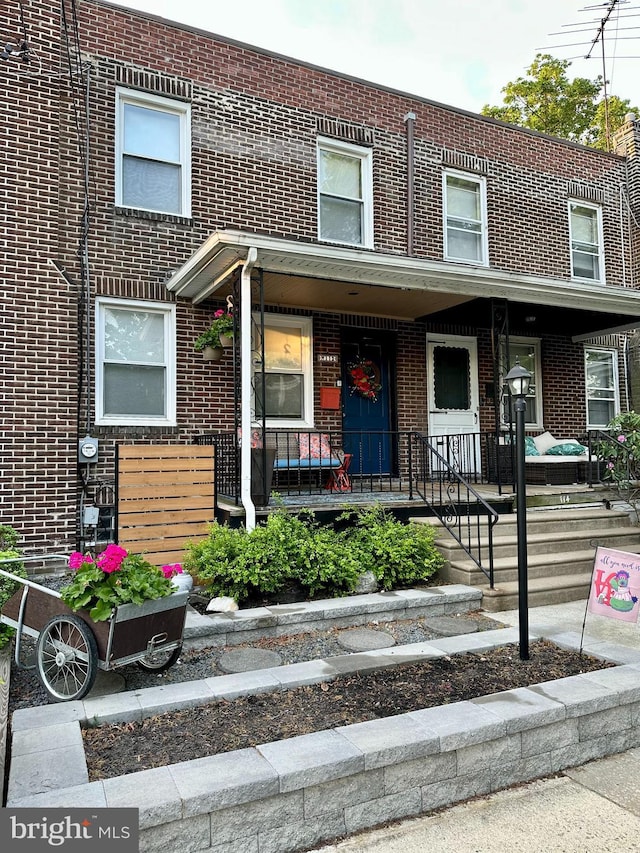 townhome / multi-family property with brick siding