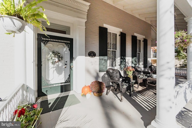 entrance to property featuring a porch