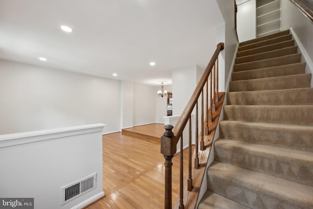 2327 London Bridge Dr, Silver Spring, MD 20906 - stairs with wood finished floors, recessed lighting, and a chandelier