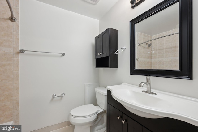 2327 London Bridge Dr, Silver Spring, MD 20906 - bathroom featuring toilet, vanity, and tiled shower
