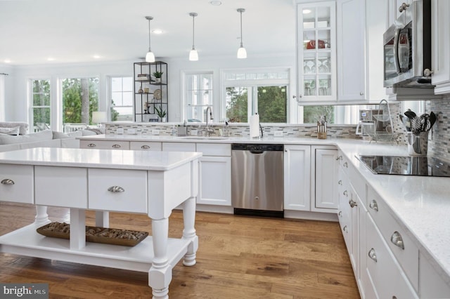 23336 Horse Island Rd, Lewes, DE 19958 - kitchen featuring white cabinetry, stainless steel appliances, tasteful backsplash, and a sink