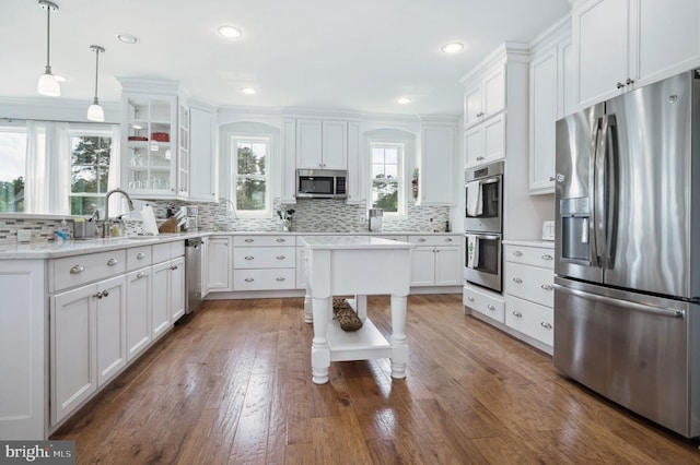 23336 Horse Island Rd, Lewes, DE 19958 - kitchen featuring stainless steel appliances, white cabinets, and a sink