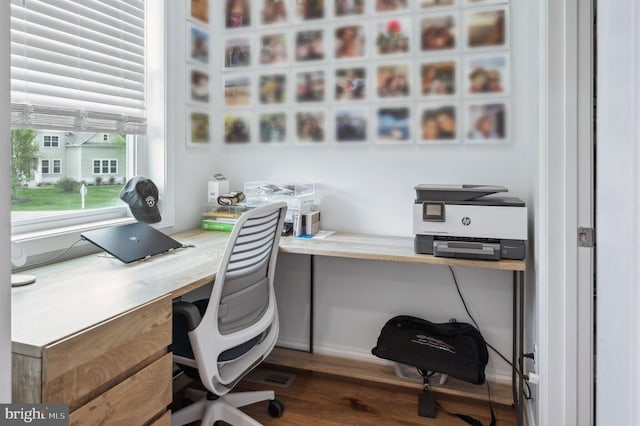 23336 Horse Island Rd, Lewes, DE 19958 - home office with built in desk and dark wood-style flooring