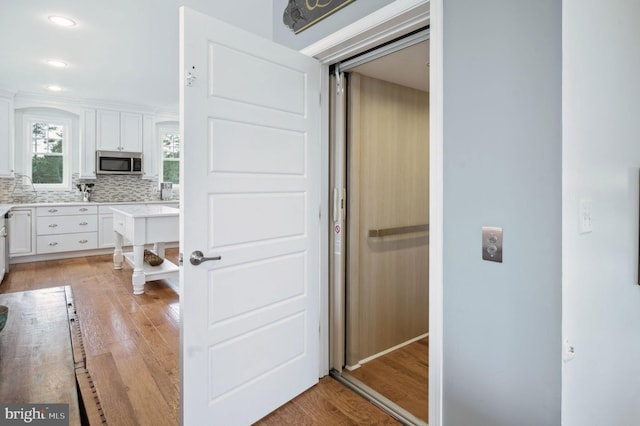 23336 Horse Island Rd, Lewes, DE 19958 - corridor with recessed lighting, elevator, and light wood-type flooring
