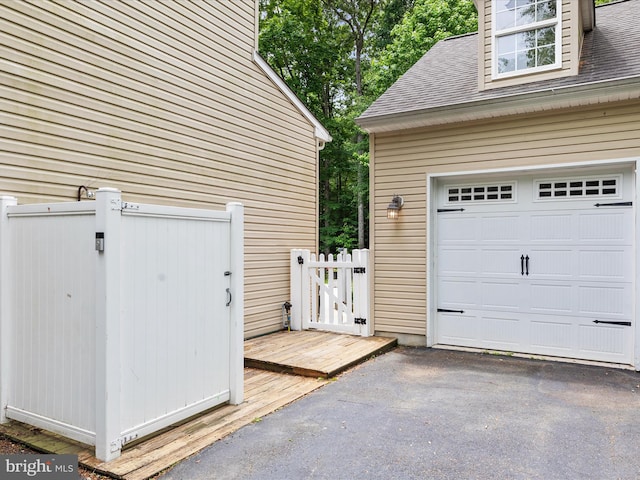 33759 Bay Ridge Ln, Lewes, DE 19958 - garage featuring a gate and driveway