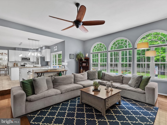 33759 Bay Ridge Ln, Lewes, DE 19958 - living room featuring a ceiling fan and light wood-type flooring