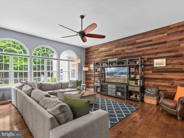 33759 Bay Ridge Ln, Lewes, DE 19958 - living area with wood walls, healthy amount of natural light, ceiling fan, and wood finished floors