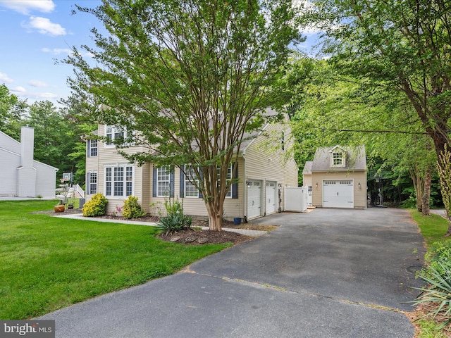 33759 Bay Ridge Ln, Lewes, DE 19958 - view of front of home featuring asphalt driveway, a front lawn, and an outbuilding