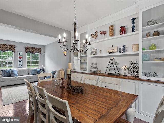 33759 Bay Ridge Ln, Lewes, DE 19958 - dining room featuring a chandelier and dark wood-style flooring