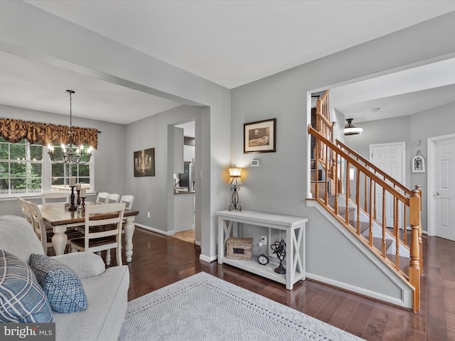 33759 Bay Ridge Ln, Lewes, DE 19958 - dining space featuring wood finished floors, a chandelier, baseboards, and stairway