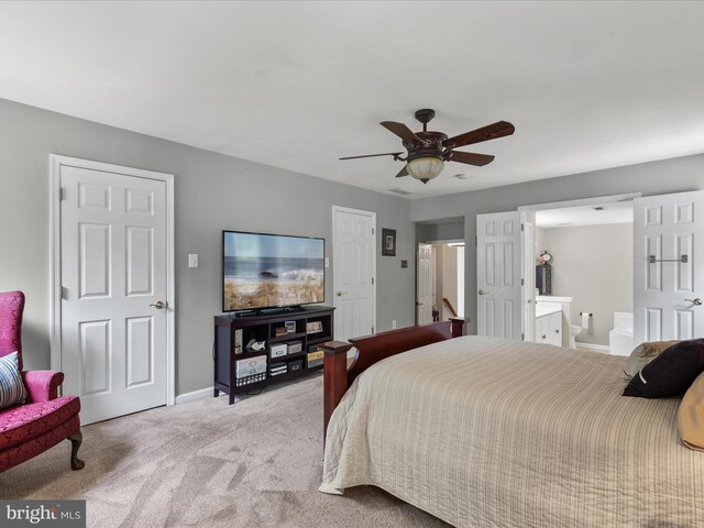 33759 Bay Ridge Ln, Lewes, DE 19958 - bedroom featuring carpet flooring, baseboards, ensuite bath, and a ceiling fan