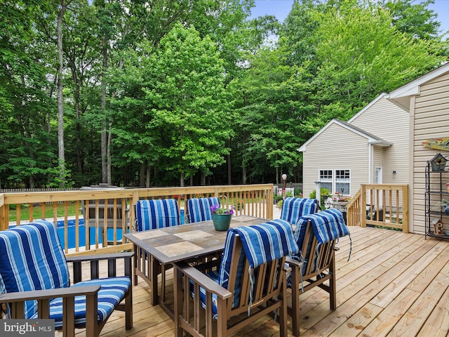 33759 Bay Ridge Ln, Lewes, DE 19958 - wooden deck featuring outdoor dining space